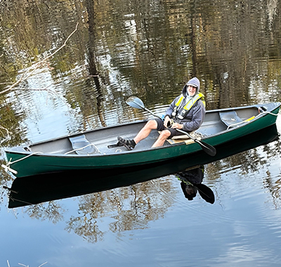Richard sitting in a canoe.
