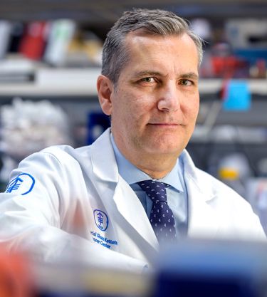 A scientist at MSK stands in a research lab, representing how donor support funds breakthrough discoveries and advances in cancer treatment.