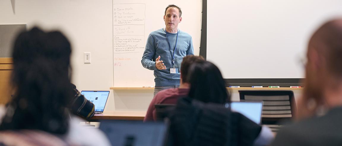 An MSK expert lecturing in front of a class 